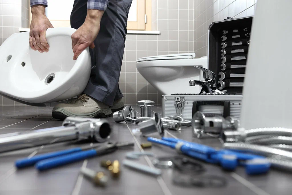 Plumbing tools prepared for a bathroom repair in West Palm Beach